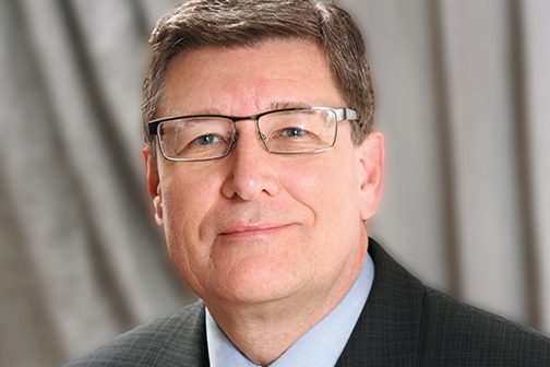 Dr. John England